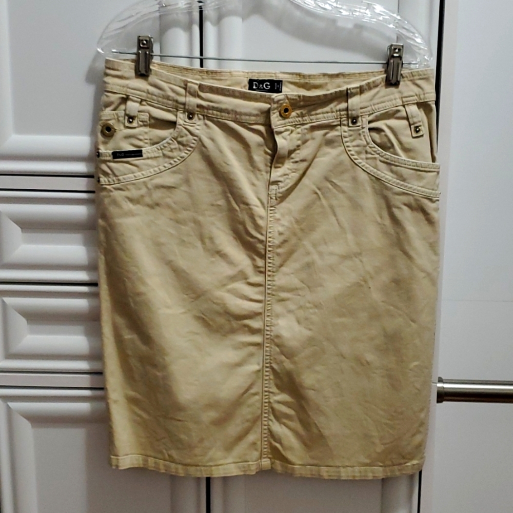 Dolce & Gabbana tan denim skirt. size 28, with slit on left side